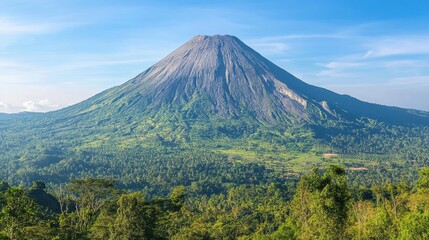 Fototapeta premium Majestic Volcano in a Lush Green Landscape Under Clear Blue Sky