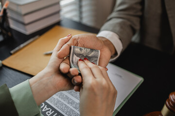 the lawyer is acting unethically and illegally because he is receiving bribes form his client's opponent, a client is bribing the opposing lawyer in order to win a case,