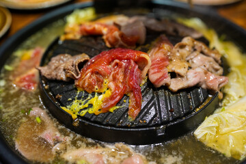 Grilled pork and beef on electronic stove. Grilled food style Pork or sea beef and boiled vegetables.
