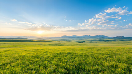 Obraz premium Sunrise over grassy plains, mountain backdrop, calm scene, nature photography