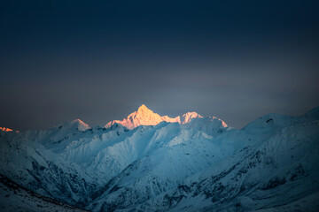 Early morning sunshine on the snowy mountain peak, Mt D'Archaic, New Zealand