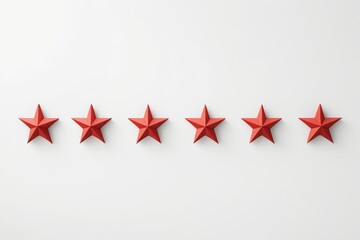 five red stars arranged in a row on a white surface