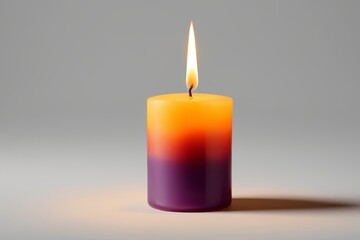 a close up of a candle with a single flame on a gray background