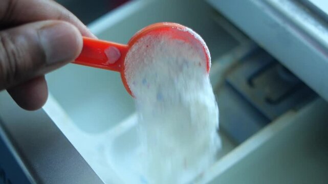 Measuring baking powder for a homemade recipe in the kitchen