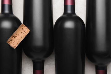 Wine cork on top of bottles of red wine
