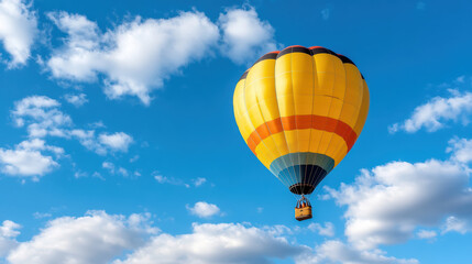 Naklejka premium bright, colorful hot air balloon rising into clear blue sky