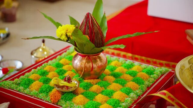 Devotee arranges garland at adorned shrine