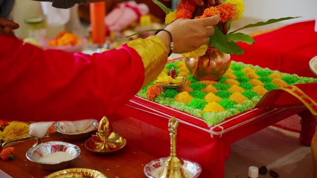 Worshiper sets flowers on sacred table