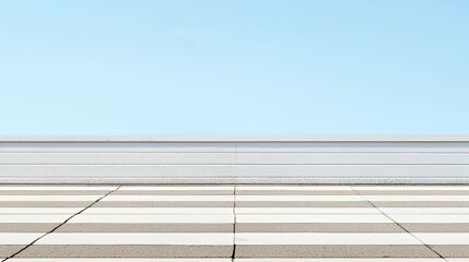 White and Grey Striped Concrete Floor Against a Clear Blue Sky