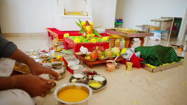Devotee prepares offerings for the sacred ritual