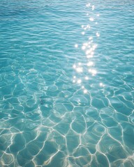 Serene turquoise water glistens under the sun creating a mesmerizing pattern of light and shadow aquatic beauty