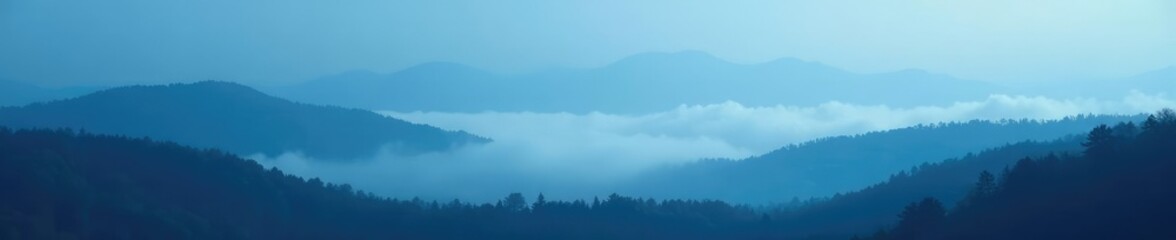 Fototapeta premium A dense fog rolling in over a blue black grainy landscape, nature, landscape
