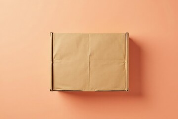 Cardboard container on a large piece of soft peach colored material, peach background, flat lay,