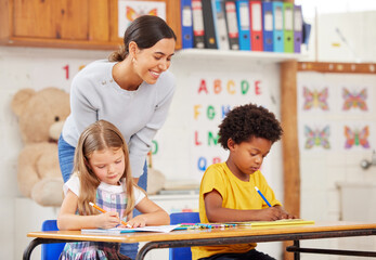 Teacher, education and students in classroom, studying and knowledge with help. Educator, woman and...