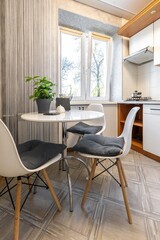 Modern Kitchen with White Furniture and Potted Plant