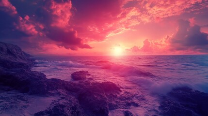 Fototapeta premium Dramatic sunset over the ocean with vibrant pink and purple clouds