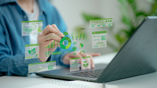 Businessmen use laptops to analyze ESG Co2 Carbon footprint Emission report graph to net zero. Green business corporate responsibility sustainable environment development goal. World Environment Day.
