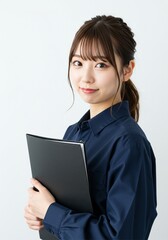beautiful young woman standing upright confidently holding a black document folder with a smiling face on a white background