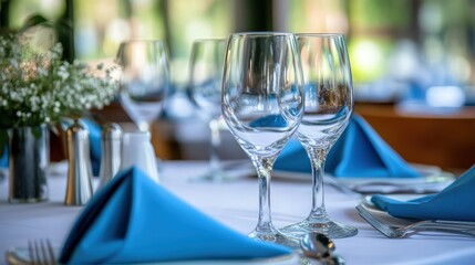 Chic and elegant table decor showcasing blue napkins and glassware