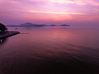 Fototapeta premium Colorful sunset or sunrise sky clouds over sea in Thailand, Amazing nature landscape seascape,Beautiful light nature landscape colorful sky background