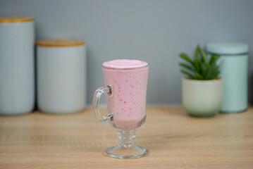 Protein berry shake in the kitchen, concept of diet and healthy eating