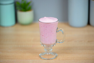 Protein berry shake in the kitchen, concept of diet and healthy eating