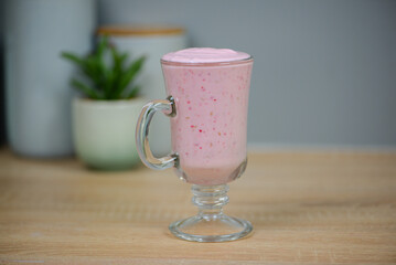 Protein berry shake in the kitchen, concept of diet and healthy eating