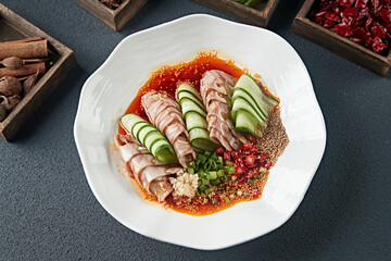 Delicious cold dish spicy pressed pig ears crispy slices with melon