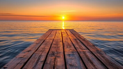 Fototapeta premium serene sunset over calm ocean with wooden dock