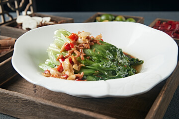 Scalded lettuce with garlic, rice, pepper and dried shrimps