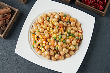 Fried sesame balls with corn and green beans