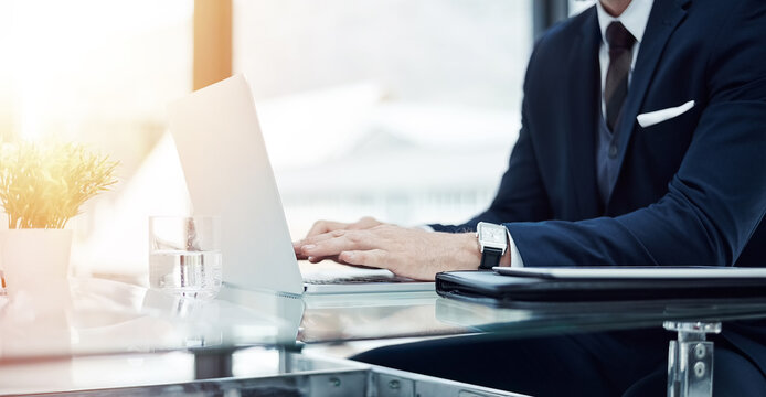 Office, hands or businessman with typing on laptop for client portfolio management, email query or customer statement. Closeup, financial advisor and tech for writing online report and tax planning
