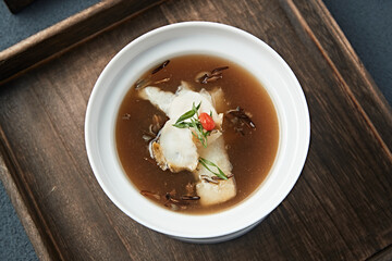 Abalone stewed with bamboo fungus in a thick soup