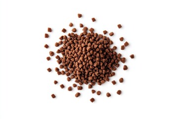 Close-up of small, brown, granular food pieces scattered on white background.