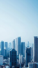 Obraz premium Blue Hues City Skyline: Highrise Buildings Under a Hazy Sky