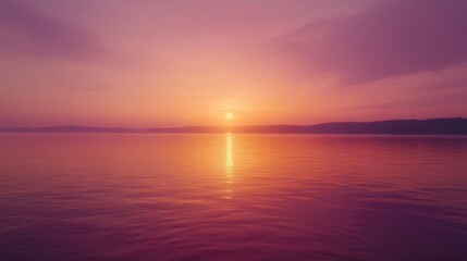 Naklejka premium Serene Sunset Over Calm Waters with Soft Reflections