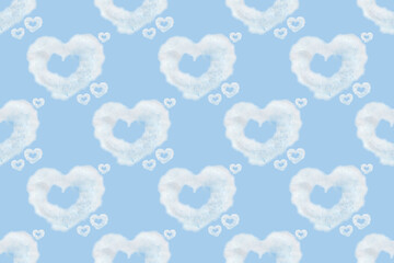 Seamless pattern of heart shaped clouds. Background of watercolor clouds on a blue sky.