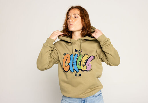 Redhead Woman Modeling a Hooded Sweater Ready for Logo Placement. Note: jumper&acute;s color cannot be changed.