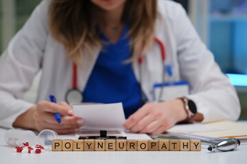 A qualified healthcare professional meticulously reviews notes on polyneuropathy within a clinical...