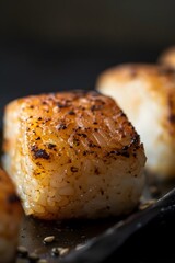 Extreme Close-up of Grilled Crispy Yaki Onigiri with Golden-Brown Charred Rice Crust