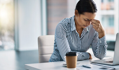 Anxiety, headache or stress with business woman at desk in office with laptop for deadline or...