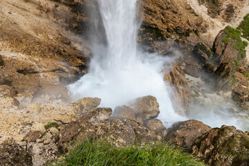 Pericnik waterfall is a beautiful drop from the mountain cliff, in Triglav National Park. Slovenian waterfall. Long for walking and trekking, enter inside the cave to admire it. Powerful and majesty.