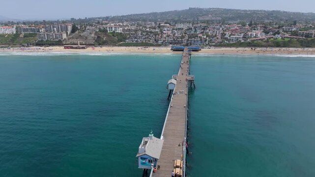 Aerial view of San Clemente pier moving toward ocean