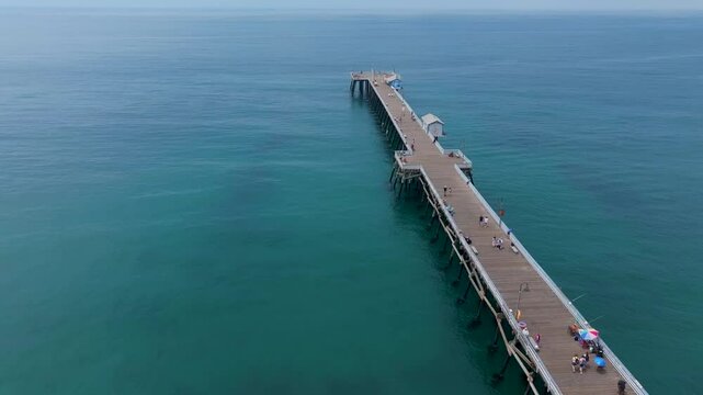 Overhead aerial view running along San Clemente pier