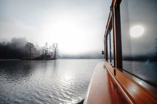 Boat on the lake at morning fog. Morning at the pond