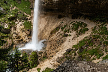 Pericnik waterfall is a beautiful drop from the mountain cliff, in Triglav National Park. Slovenian waterfall. Long for walking and trekking, enter inside the cave to admire it. Powerful and majesty.
