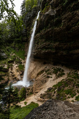 Pericnik waterfall is a beautiful drop from the mountain cliff, in Triglav National Park. Slovenian waterfall. Long for walking and trekking, enter inside the cave to admire it. Powerful and majesty.