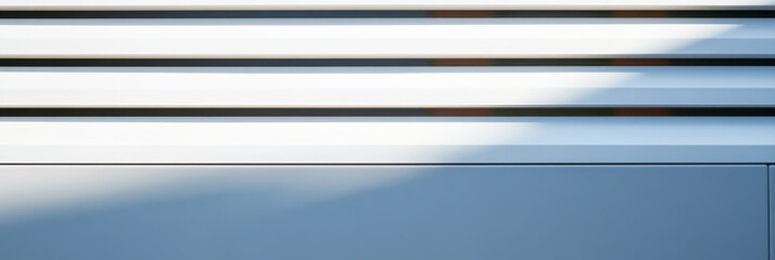 Fototapeta premium Light and shadow play on modern architectural elements in a minimalistic design