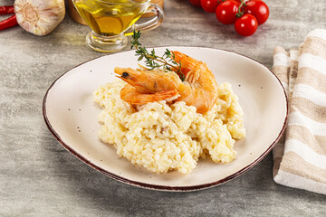 Italian risotto with prawn served thyme