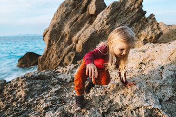 Child girl walking exploring seaside family vacations travel active lifestyle adventure, 4 years...